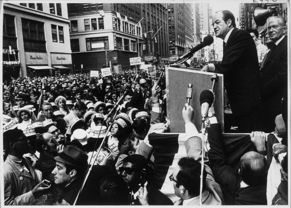 Hubert Humphrey addressing a massive crowd in the streets